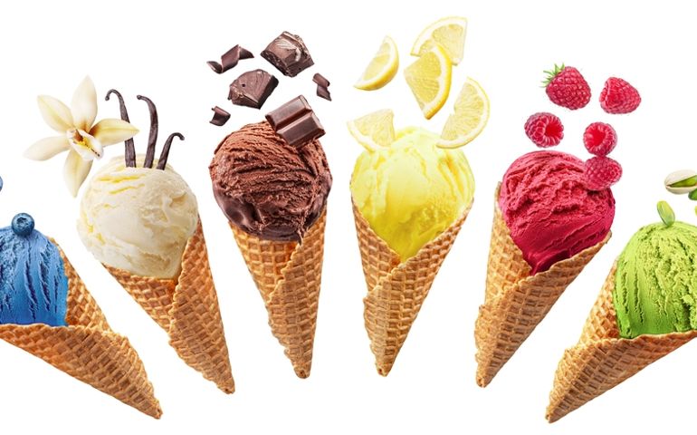 Set of different types of ice cream balls in waffle cones with ice cream ingredients - fruits, berries and sweets. Isolated on a white background. Clipping Path.