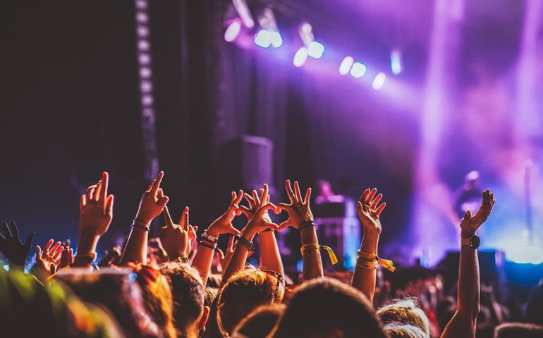 crowd partying stage lights live concert summer music festival