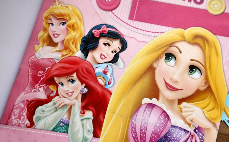 Disney princesses. Aurora from Cinderella, Snow White, Rapunzel, and Ariel the Little Mermaid. Illustrations in a magazine. Characters from classic children's stories