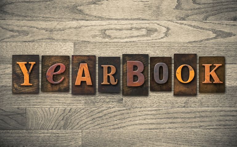 The word -YEARBOOK- written in vintage wooden letterpress type.