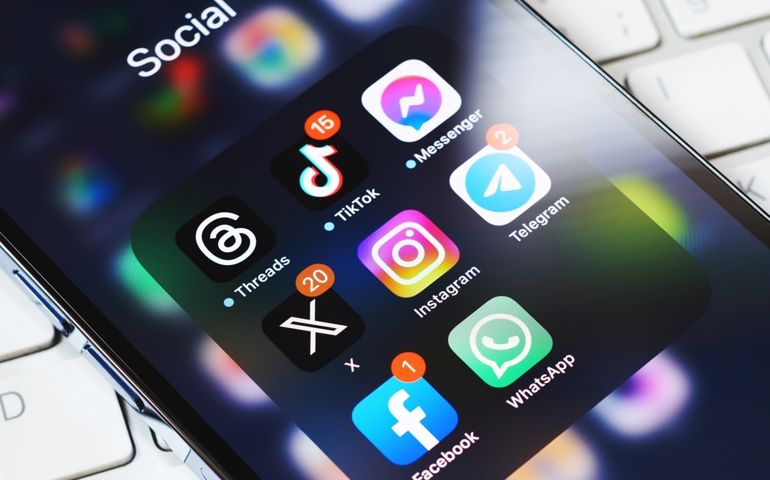 Moscow, Russia, 29-07-2023: New Elon Musk's twitter X app on smartphone screen surrounded by other social media network apps. Twitter rebranding. Modern social media communication.