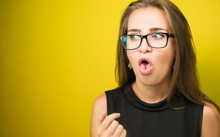 Portrait of a young business woman showing disgust