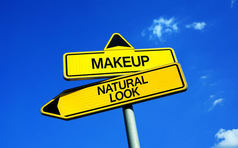 Makeup or Natural Look - Traffic sign with two options - using cosmetics for enhancing attractiveness of face vs be without any cosmetic product and prefer natural beauty