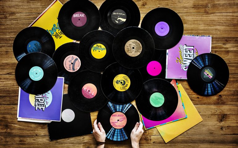 Hands holding music vinyl collectible record