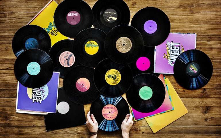 Hands holding music vinyl collectible record
