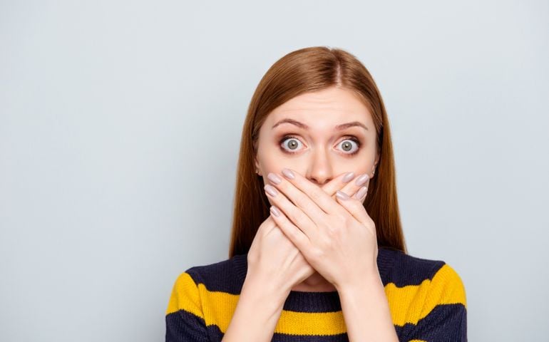 Hush scared business people coughing big pop-eyed fashion concept. Close up portrait of pretty cute terrified frightened mute silent manager model with palms over mouth isolated gray background