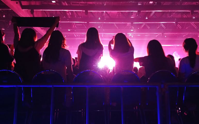 K-Pop music theme or live concert background silhouette of girls holding hands and sign for artist supporting.