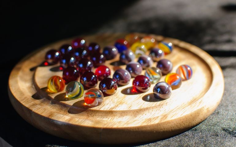Marbles are spherical glass toys used to play a variety of different games.