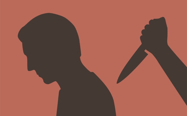 Treachery concept. Man being stabbed in the back.