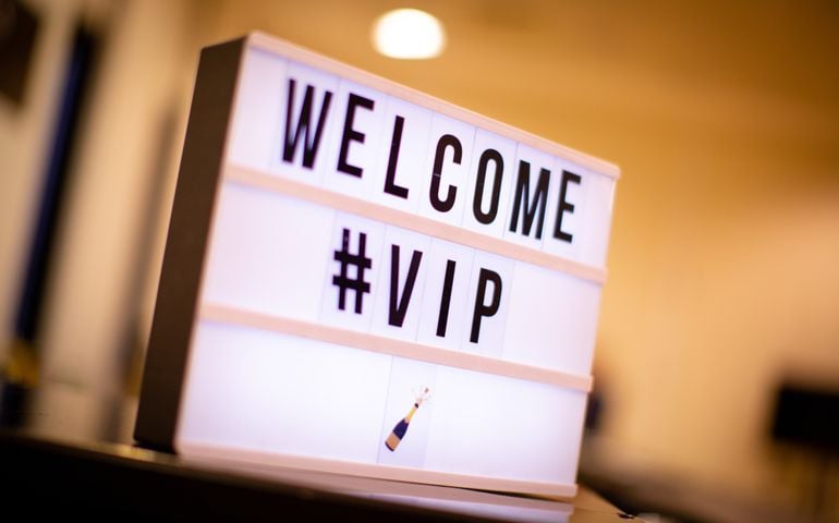 Welcome VIP illuminated whiteboard sign in hospitality suite
