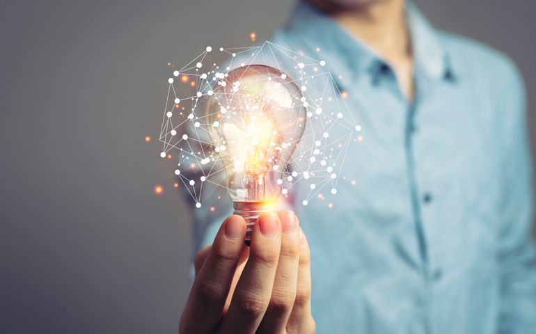 Man holding light bulbs, ideas of new ideas with innovative technology and creativity. concept creativity with bulbs that shine glitter.