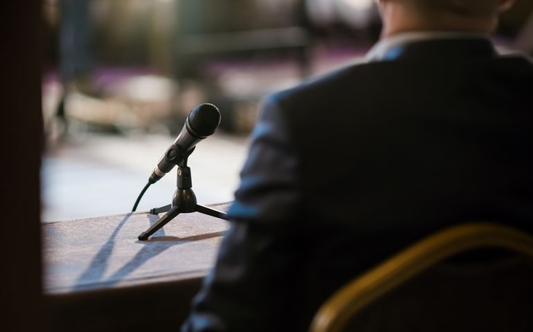 man giving statement in court during interrogation
