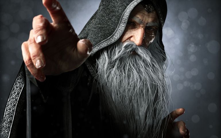Portrait closeup of a wise Warlock old hooded wizard posing ready to cast an enchanted powerful spell with a blue gradient background.