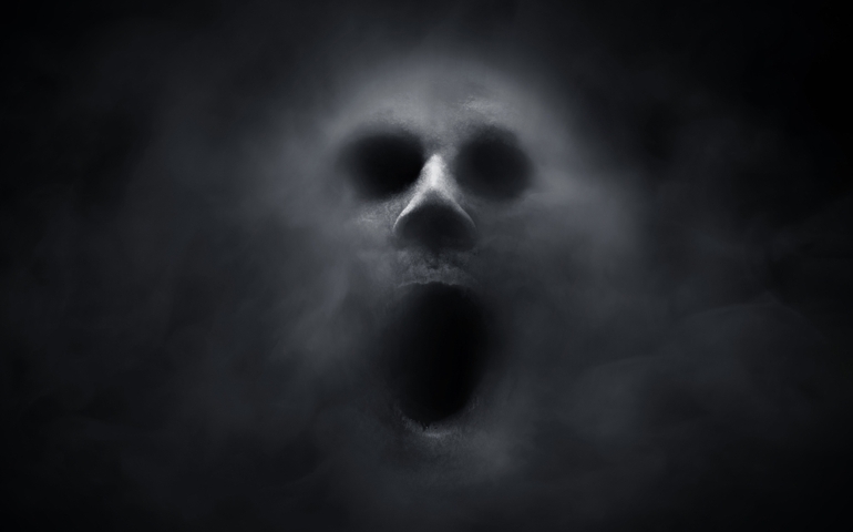 Scary ghost on dark background