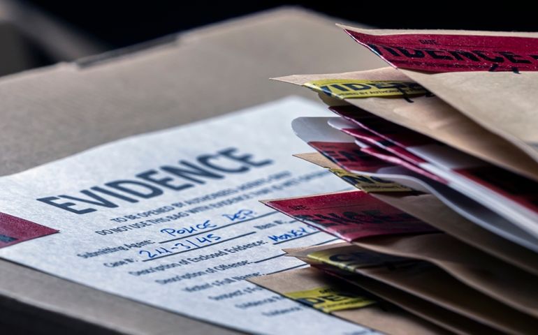 Files and evidence bag in a crime lab, conceptual image