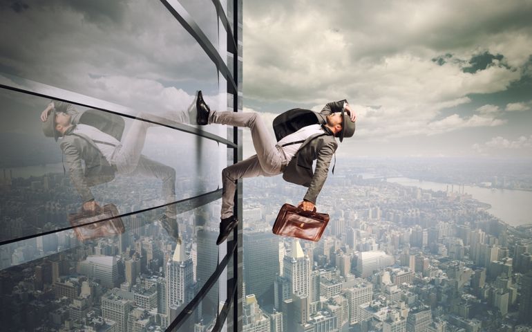 Determined man running up a skyscraper