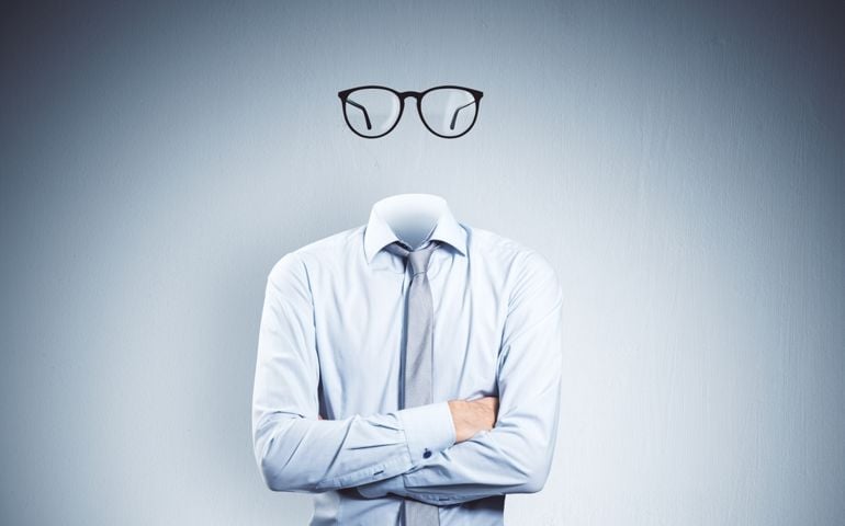 Headless invisible businessman with folded arms and abstract glasses
