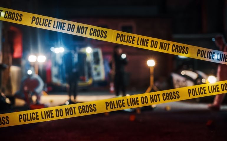 Crime Scene at Night: Crime Scene Investigation Team Working on a Murder.