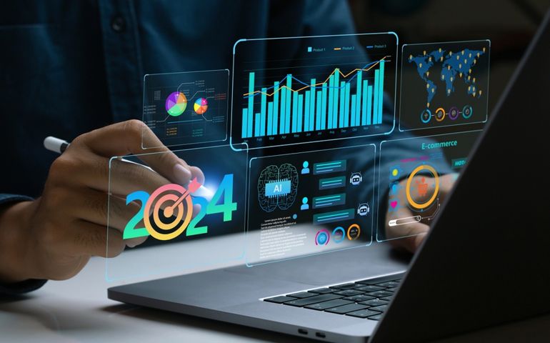 Businessman works on laptop Showing 2024 business trends dashboard with charts, metrics, AI, E-commerce, KPI. analytical businessperson planning business growth 2024. New Year Future business