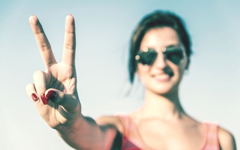 Retro Photo Of Young Girl With Victory Sign