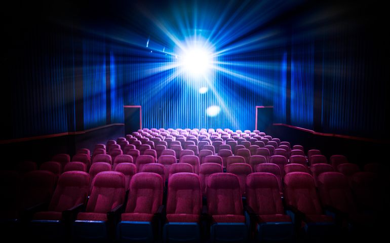 Movie Theater with empty seats and projector / High contrast image