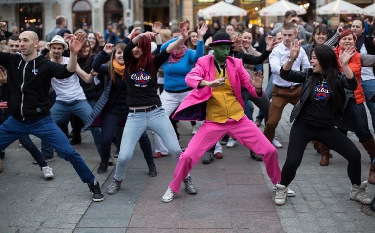 Several hundred persons dance Hispanic rhythms on the Main Square in Cracow