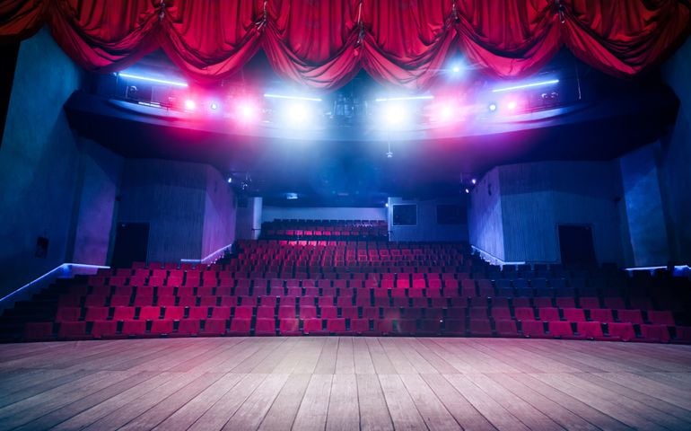 Theater curtain and stage with dramatic lighting