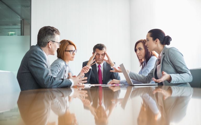 Businesspeople arguing in meeting