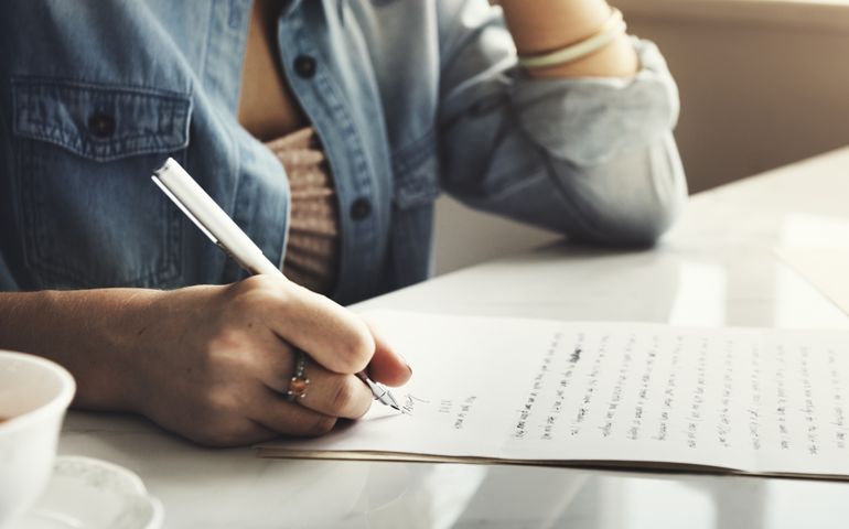 Girl Writing Letter Home Concept