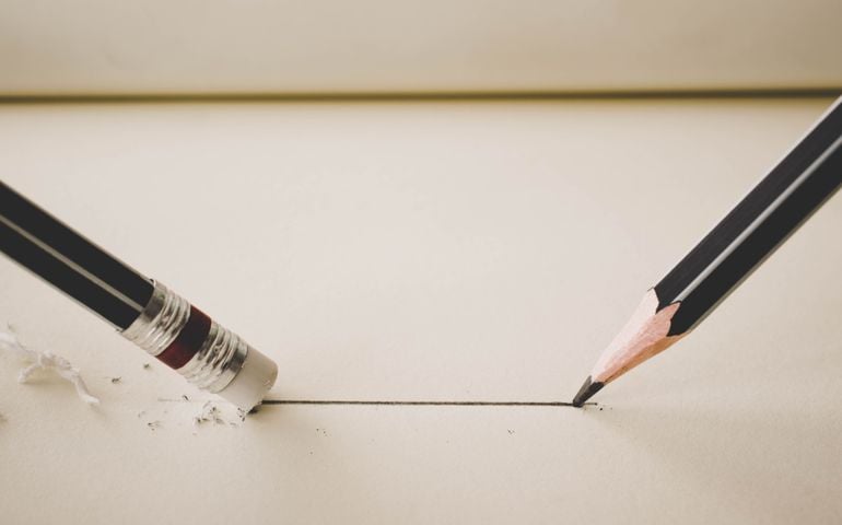 pencil draw a straight line on paper and pencil eraser removing stripe.