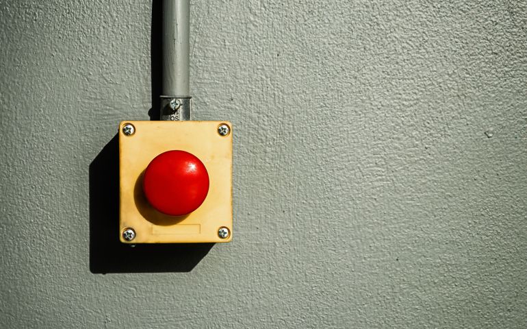 Big red button on wall