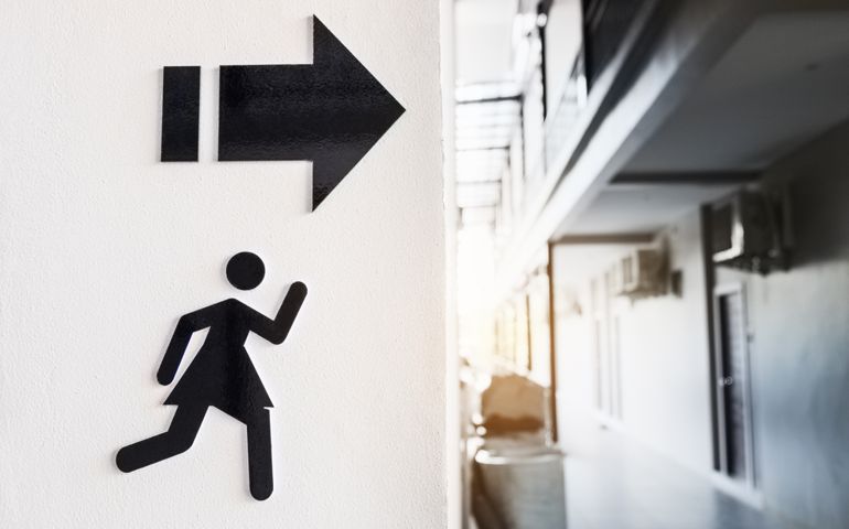 Sign of woman toilet on white cement wall background.