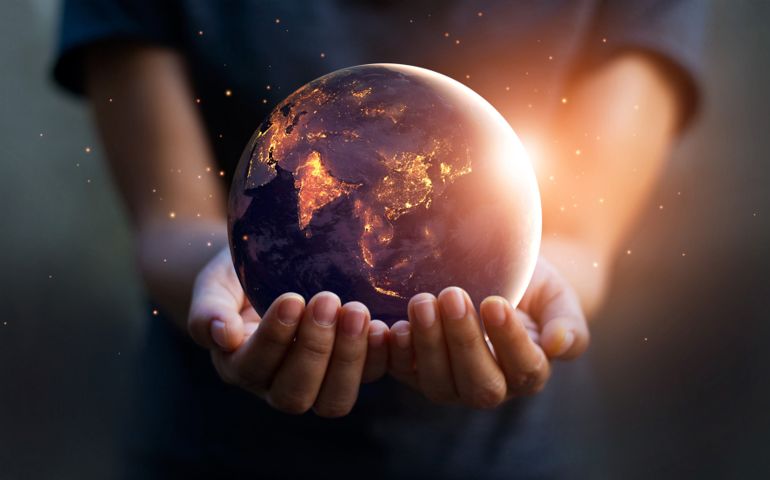 Earth at night was holding in human hands. Earth day