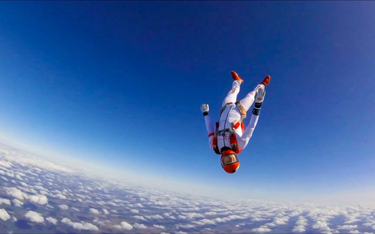 Extreme sports catapult parachutist. The sky is a working environment for a skydiver.Sports adrenaline hobbies marketing. Beautiful views from the height of bird flight.