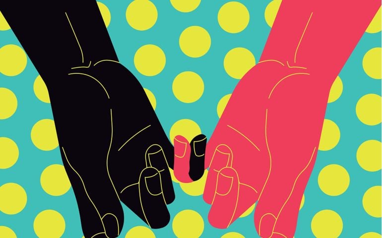 gay couple holding hands. Men's forearms with hands holding each others pinky fingers, dotted background