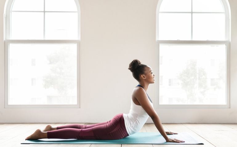 Black lady doing a Bhujangasana pose