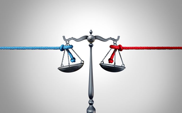 Politics and law or political legislation fight as a left and right leaning rope in a tug of war struggling to win judicial and constitutional laws with 3D illustration elements.