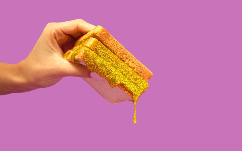 Christmas sandwich with golden glittering. Bizarre concept.