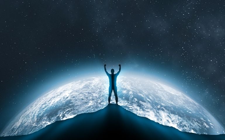 Man Standing Against planet Earth At Night. Silhouette man Standing Against starry sky and planet earth. success, achievement and goal concept. competition and leadership concept
