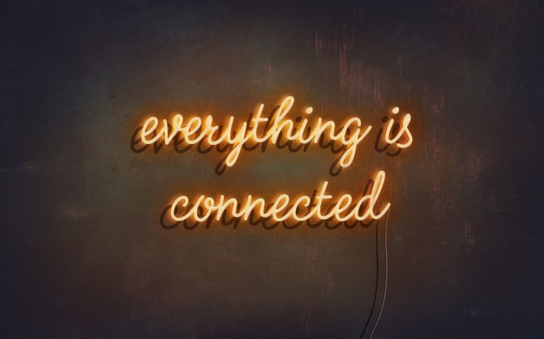 everything is connected yellow neon sign