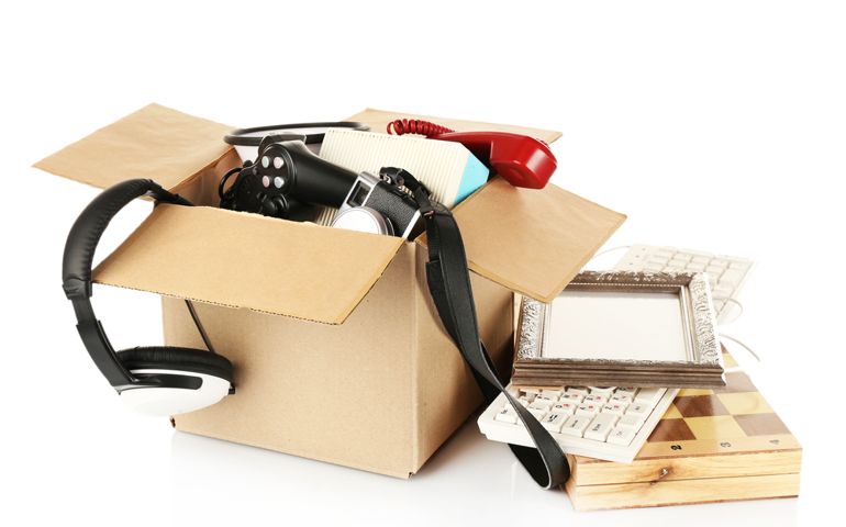 Box of unwanted stuff isolated on white