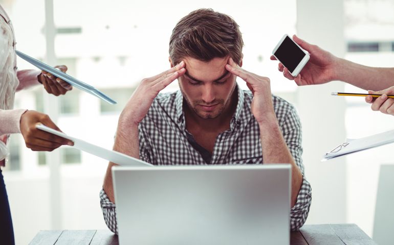 Businessman stressed out at work in casual office