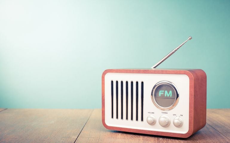Retro old radio front mint green background. Vintage style filtered photo