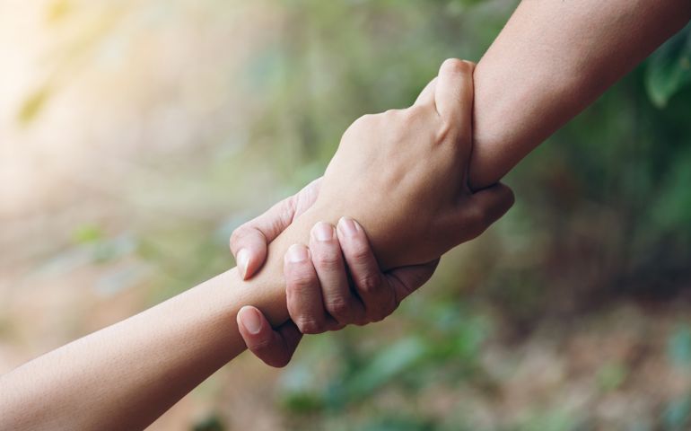 Teamwork respect relationship rescue two buddy Friends trust helping holding hands pulled Help grip each other agreement contract together