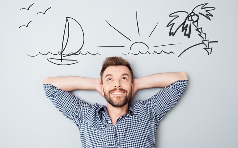 Happy young man dreaming about vacation. Drawn picture of seaside overhead.