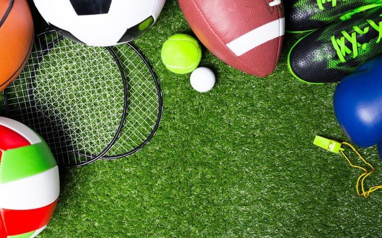 Various sport tools on grass