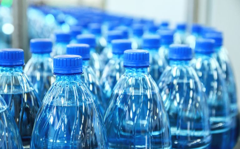 Closeup on mineral water bottles in raw and lines