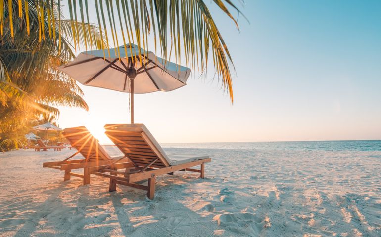 Beautiful beach. Chairs on the sandy beach near the sea. Summer holiday and vacation concept for tourism. Inspirational tropical landscape