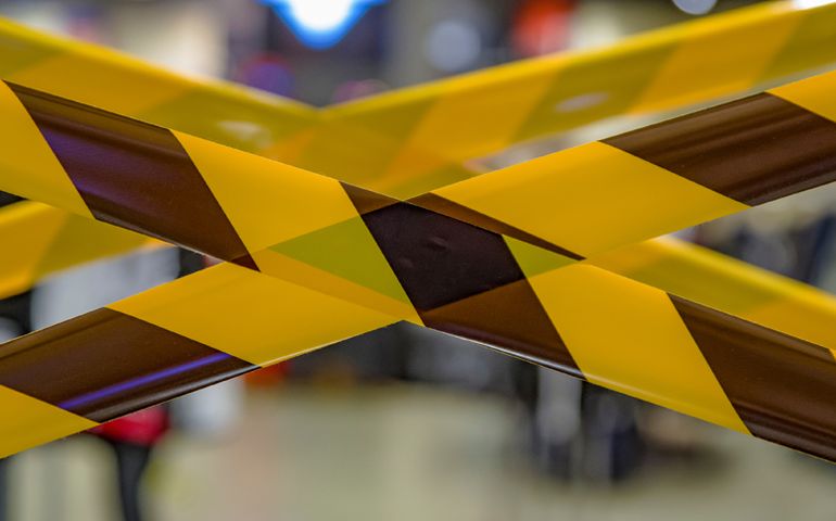 Barrier tape for prohibiting entry into the quarantine zone. Don't cross the belts. Yellow and black hazard ribbons