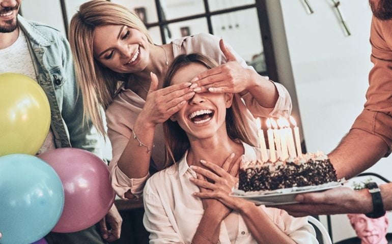 Group of young people preparing surprise party for their friend on birthday